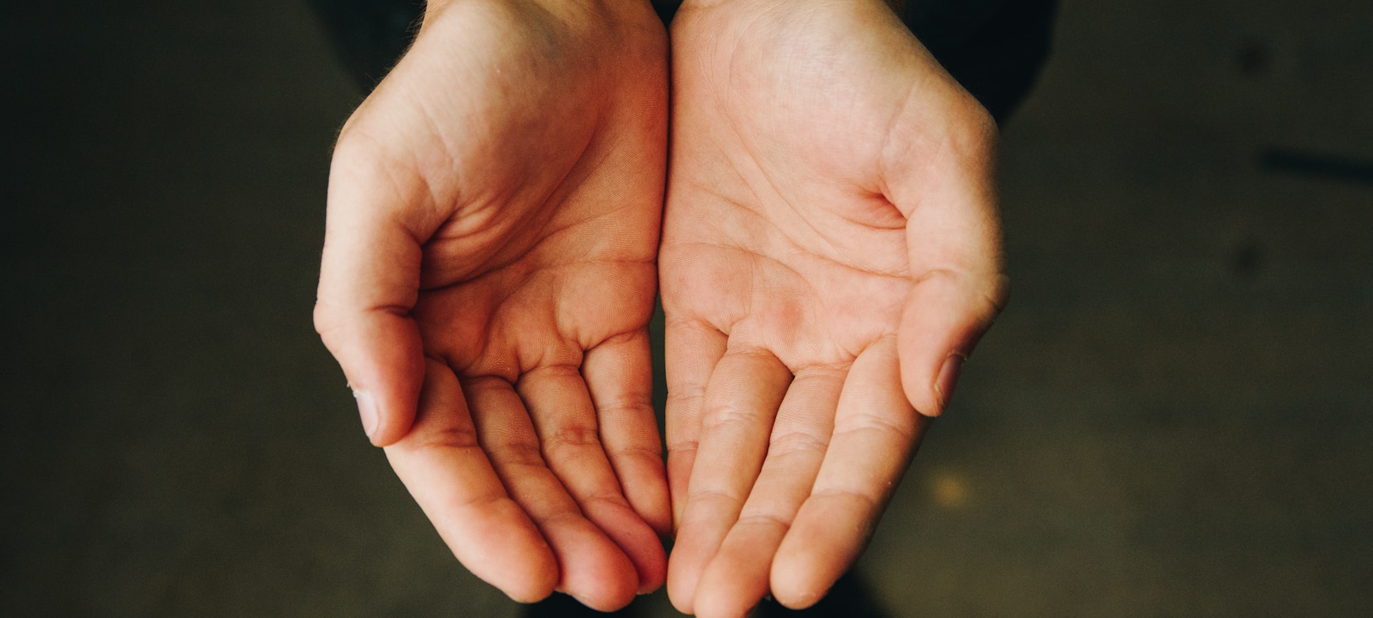 Two open hands held together with palms facing upward